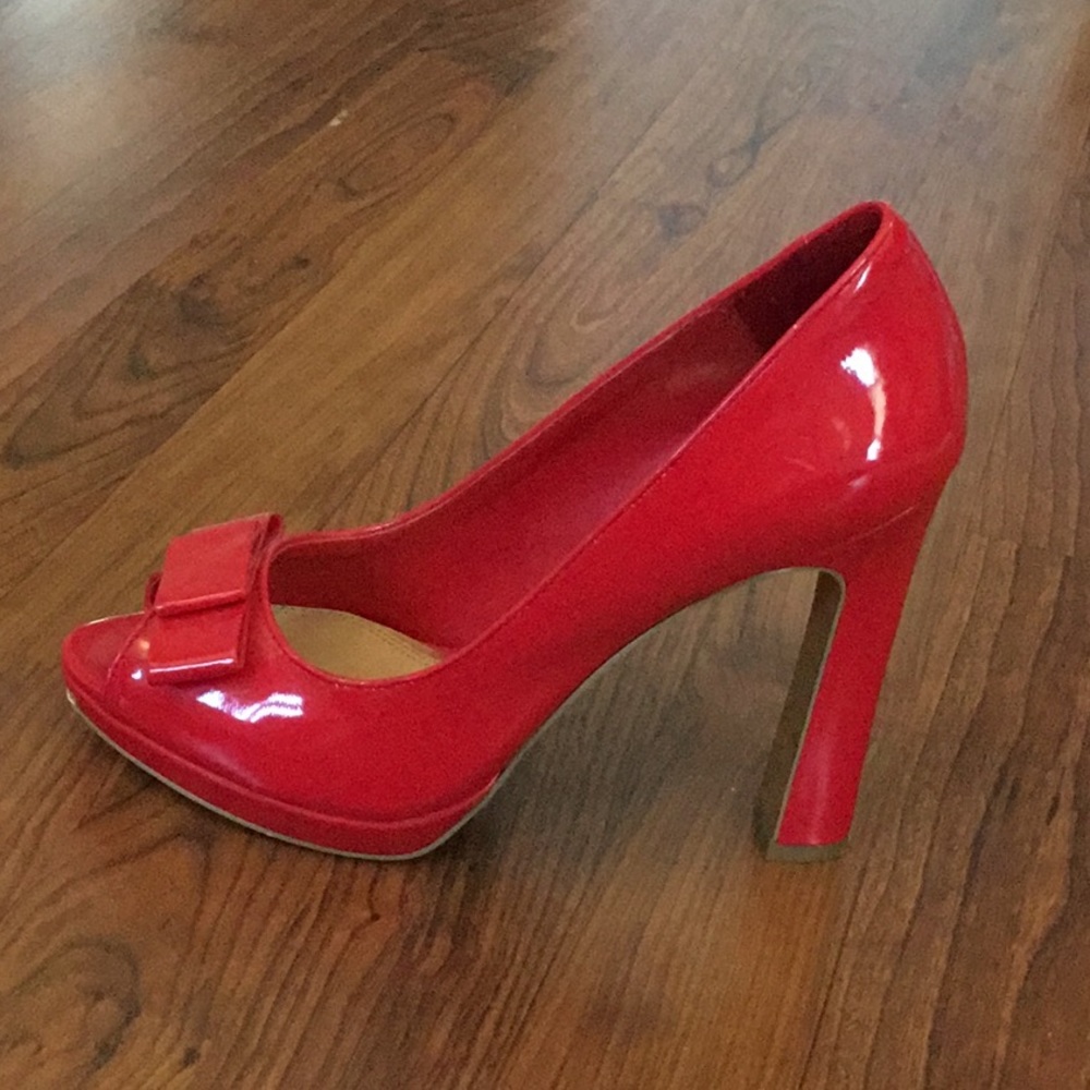 Red patent peep toe pumps